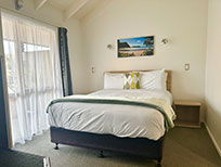 queen bed in bedroom